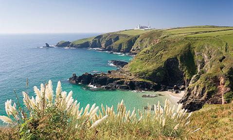 The wild cliffs of the United Kingdom overlook the sea, the perfect destination for a United Kingdom yacht charter